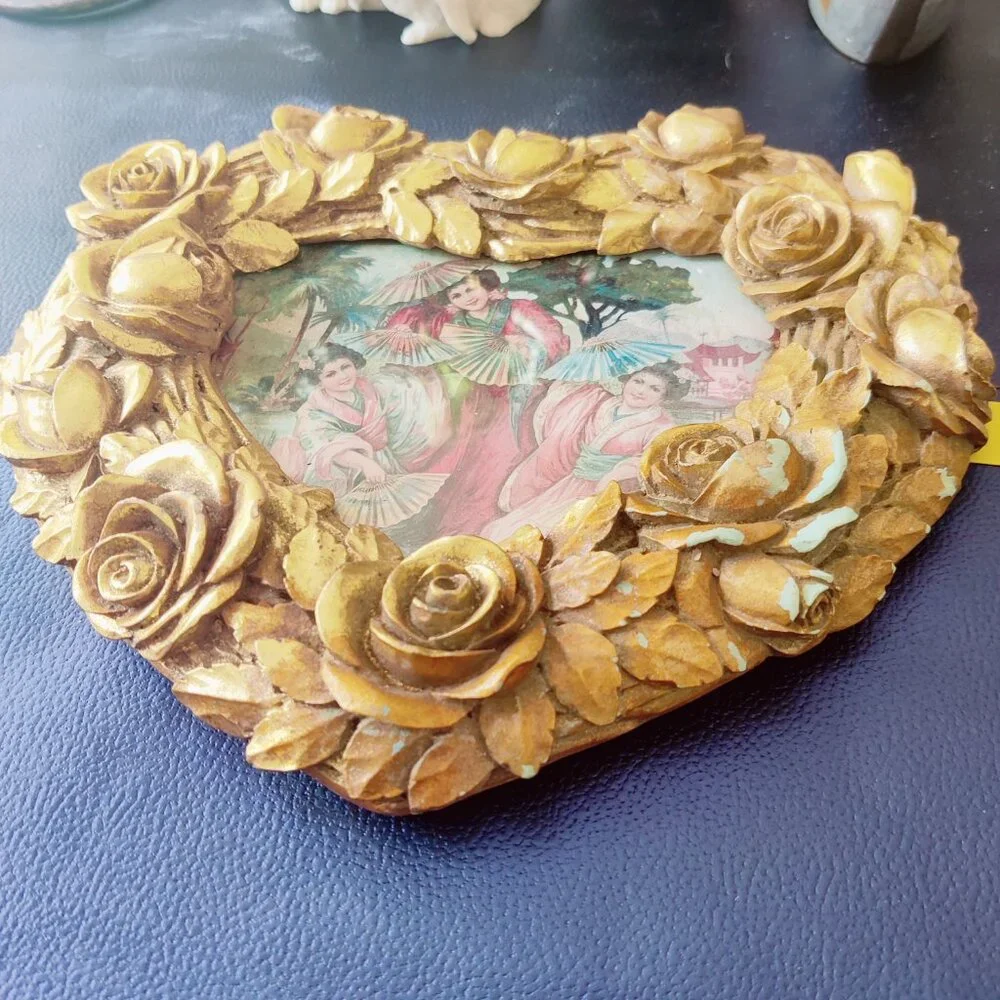 Picture Frames from Nordstroms a heavy gold heart frame with Roses & Leaf Border